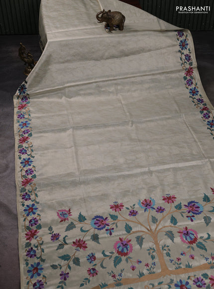 Art tissue saree beige with allover zari woven brocade weaves and embroidery work border
