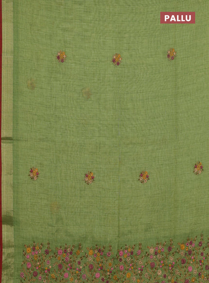 Linen cotton saree light green and maroon with embroidery buttas and zari woven border