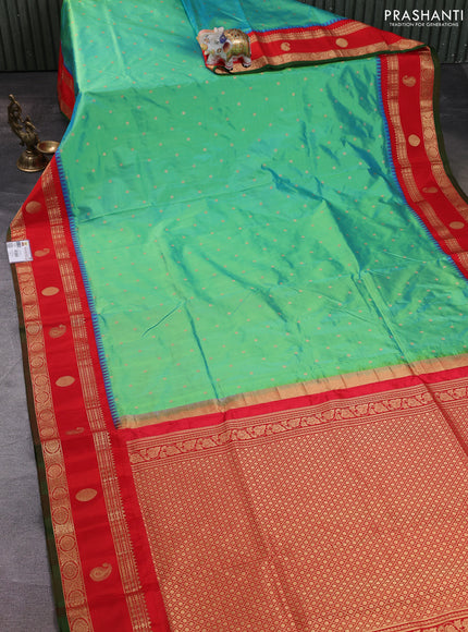 Narayanpet silk saree dual shade of teal green and red with allover zari woven buttas and temple design rettapet zari woven butta border