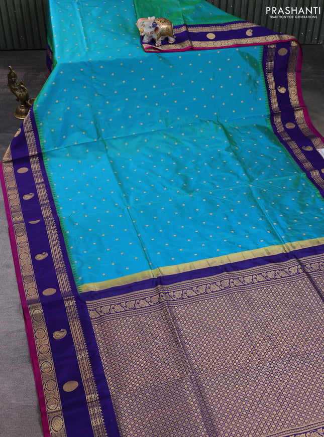 Narayanpet silk saree dual shade of bluish green and navy blue with allover zari woven buttas and temple design zari woven border