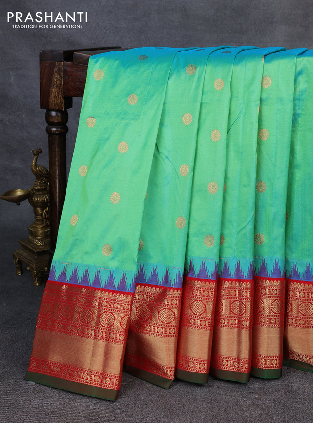 Narayanpet silk saree dual shade of teal green and red with allover zari woven buttas and temple design zari woven border