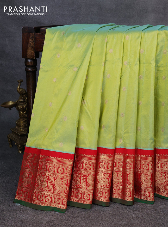 Narayanpet silk saree fluorescent green and red with allover zari woven buttas and zari woven korvai border