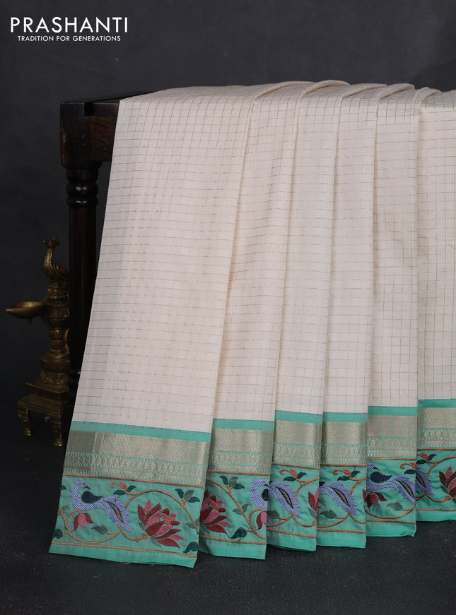 Tussar silk saree off white and teal green with allover zari ckecked pattern and zari woven embroidery work border
