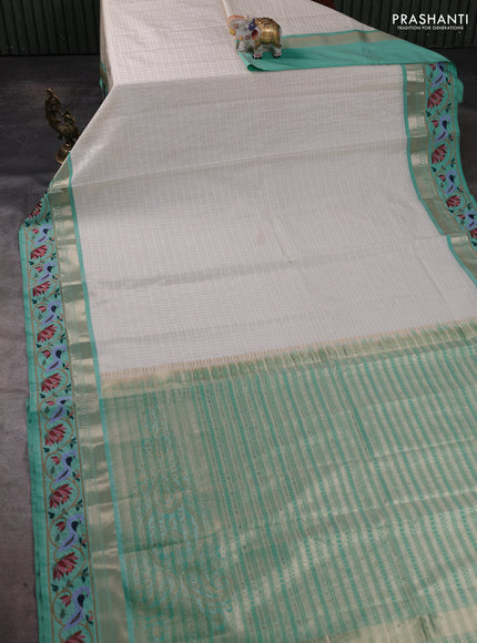 Art tussar silk saree off white and teal green with allover zari ckecked pattern and zari woven embroidery work border