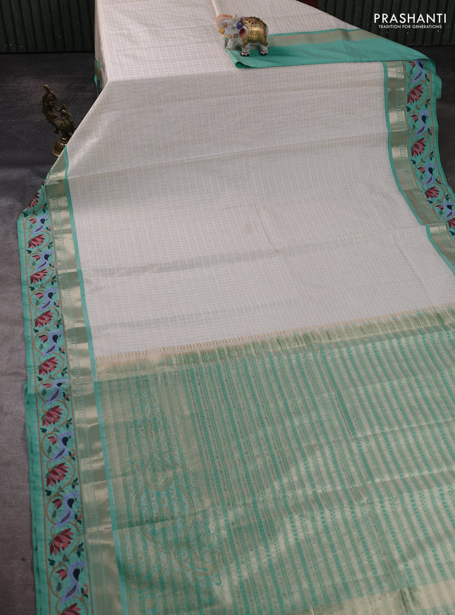 Tussar silk saree off white and teal green with allover zari ckecked pattern and zari woven embroidery work border