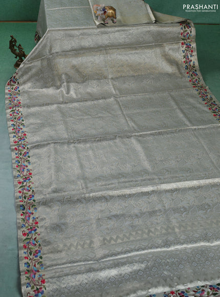 Art tissue silk sare pastel grey with allover brocade weaves and embroidery work border