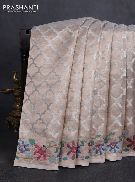 Art tissue silk sare beige with allover brocade weaves and embroidery work border