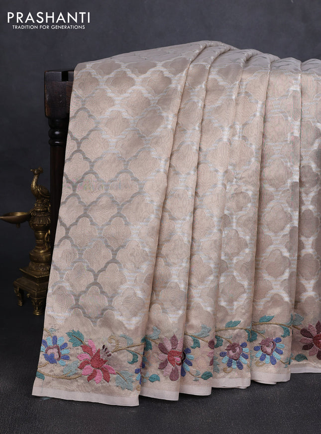 Tissue silk sare beige with allover brocade weaves and embroidery work border