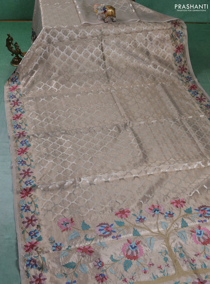 Art tissue silk sare beige with allover brocade weaves and embroidery work border
