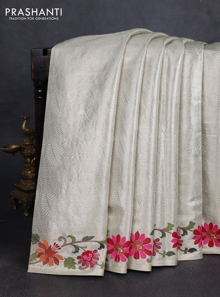 Art tissue silk sare cream with allover brocade weaves and embroidery work border