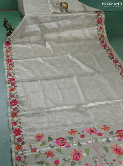 Art tissue silk sare cream with allover brocade weaves and embroidery work border