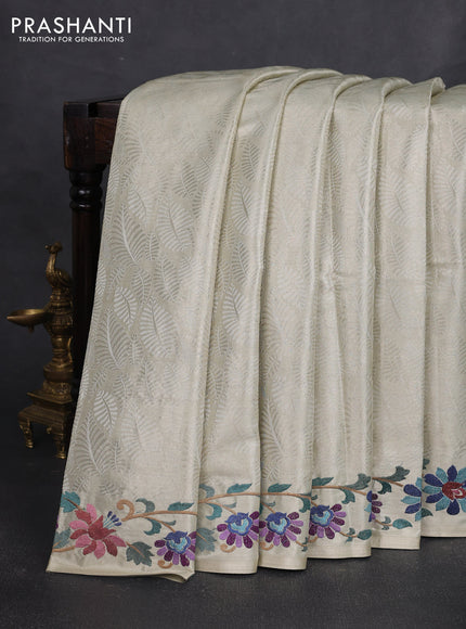 Art tissue silk sare off white and pink rust shade with allover brocade weaves and embroidery work border