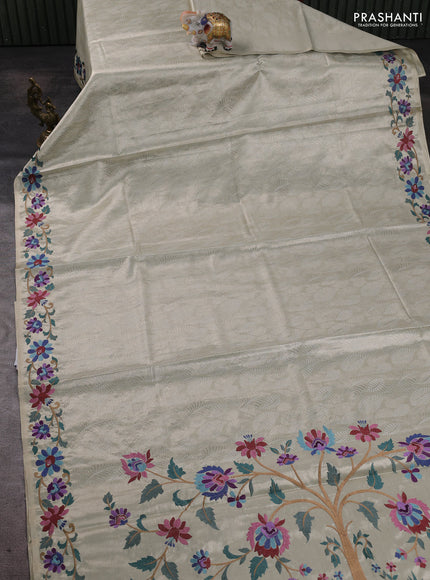 Art tissue silk sare off white and pink rust shade with allover brocade weaves and embroidery work border