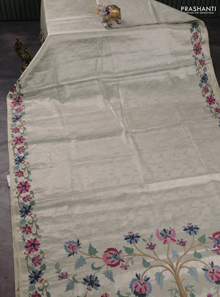 Art tissue silk sare off white and grey black with allover brocade weaves and embroidery work border