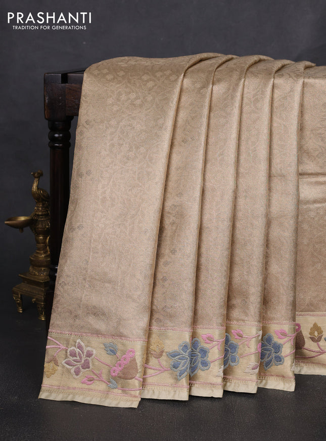 Tissue silk sare sandal shade and brown light pink with allover brocade weaves and embroidery work border