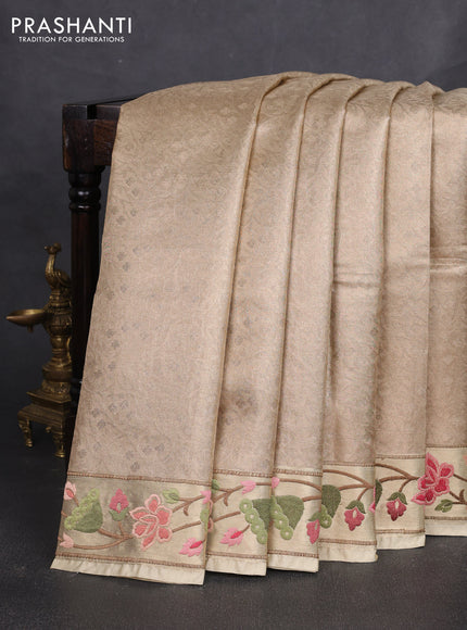 Art tissue silk sare sandal and light green brown with allover brocade weaves and embroidery work border