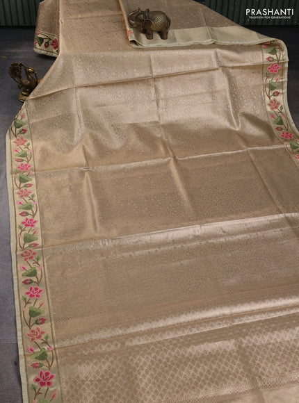 Art tissue silk sare sandal and light green brown with allover brocade weaves and embroidery work border