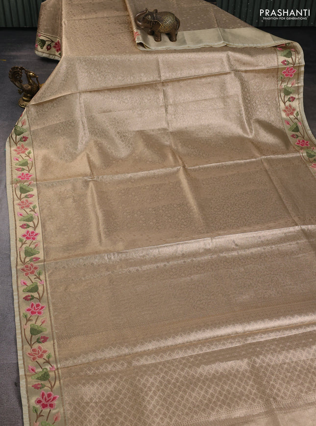 Tissue silk sare sandal and light green brown with allover brocade weaves and embroidery work border