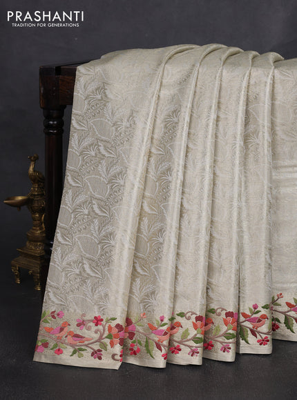 Art tissue silk sare golden beige with allover brocade weaves and embroidery work border