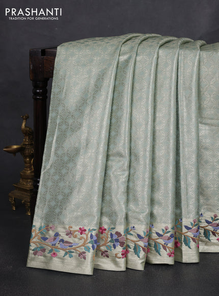 Art tissue silk sare gold pastel green with allover brocade weaves and embroidery work border