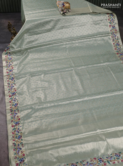 Art tissue silk sare gold pastel green with allover brocade weaves and embroidery work border