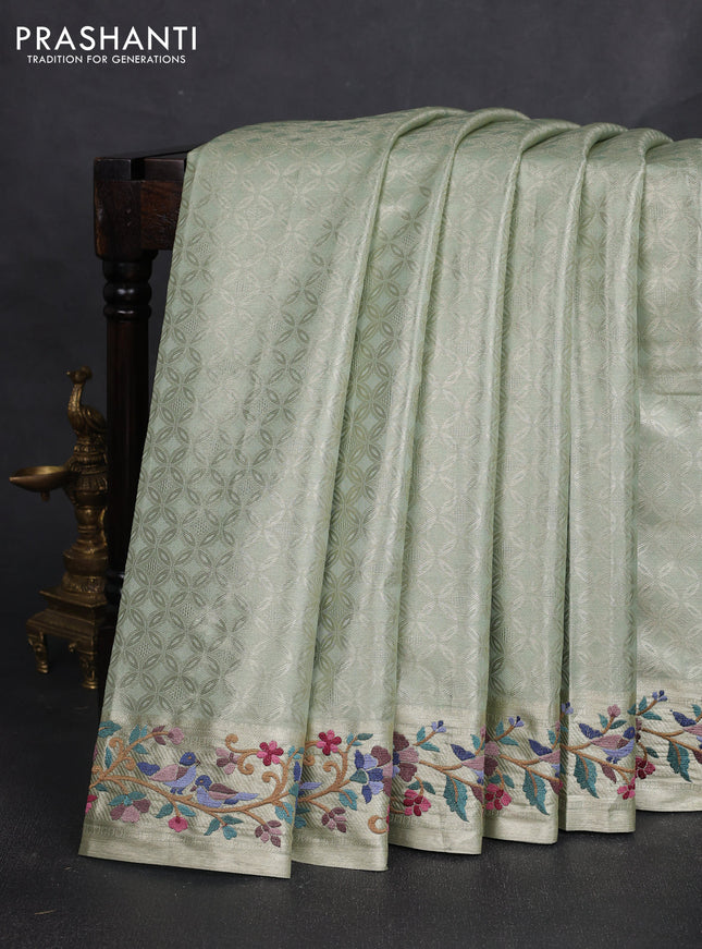 Tissue silk sare pista green with allover brocade weaves and embroidery work border