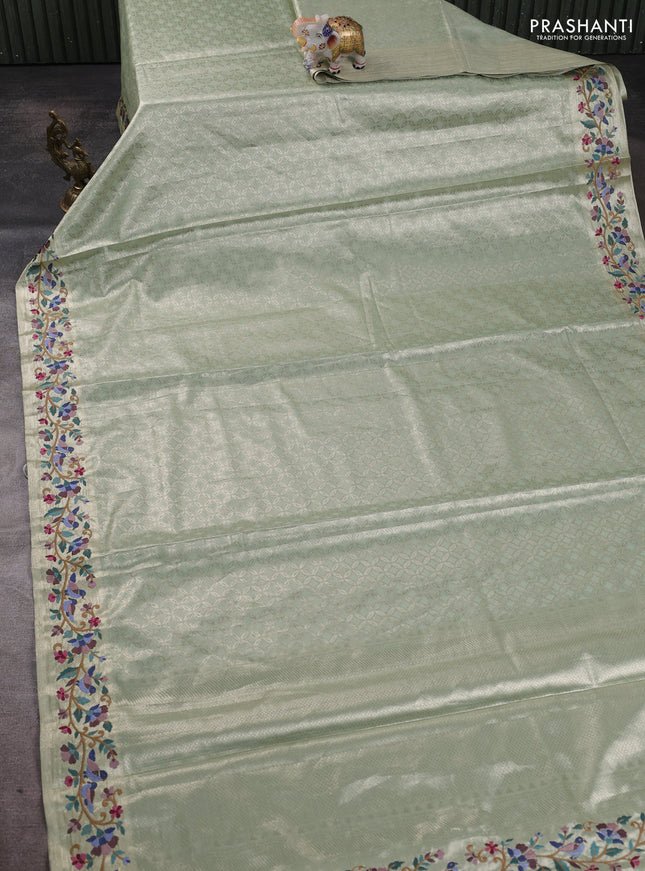 Tissue silk sare pista green with allover brocade weaves and embroidery work border