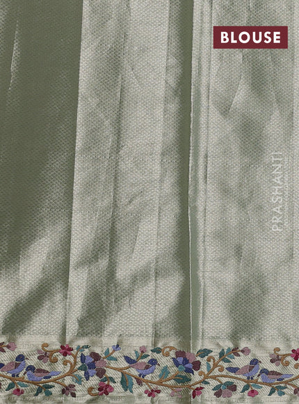 Art tissue silk sare pista green with allover brocade weaves and embroidery work border