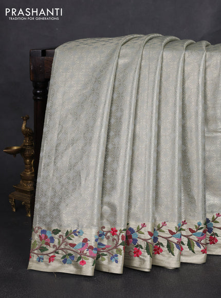 Art tissue silk sare pastel grey with allover brocade weaves and embroidery work border
