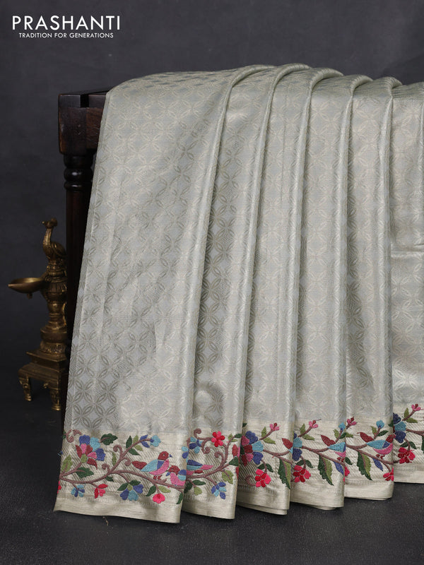 Art tissue silk sare pastel grey with allover brocade weaves and embroidery work border