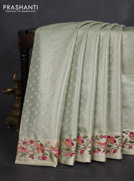 Art tissue silk sare pastel green with allover brocade weaves and embroidery work border