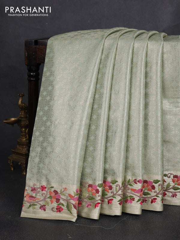 Art tissue silk sare pastel green with allover brocade weaves and embroidery work border