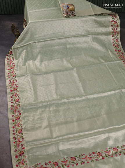 Art tissue silk sare pastel green with allover brocade weaves and embroidery work border