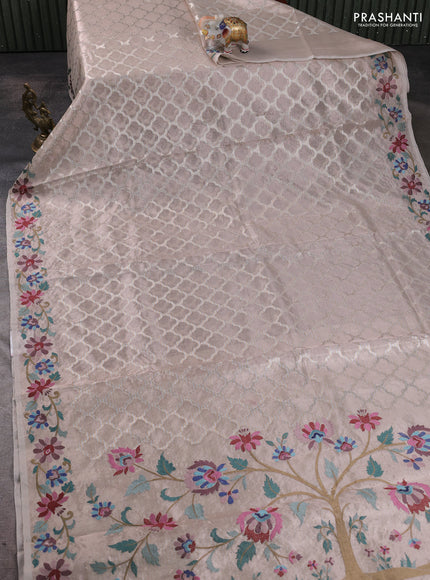 Art tissue silk sare pastel pink shade with allover brocade weaves and embroidery work border
