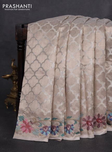 Art tissue silk sare beige with allover brocade weaves and embroidery work border