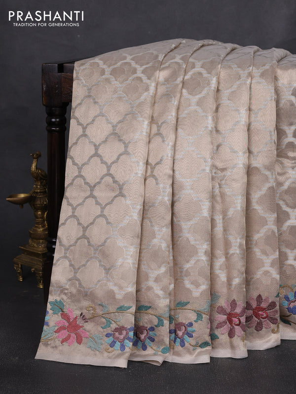 Art tissue silk sare beige with allover brocade weaves and embroidery work border