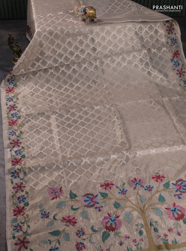 Tissue silk sare beige with allover brocade weaves and embroidery work border