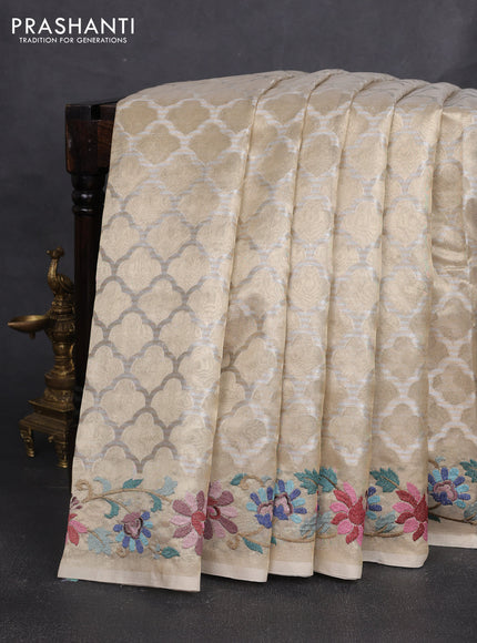 Art tissue silk sare pastel grey with allover brocade weaves and embroidery work border