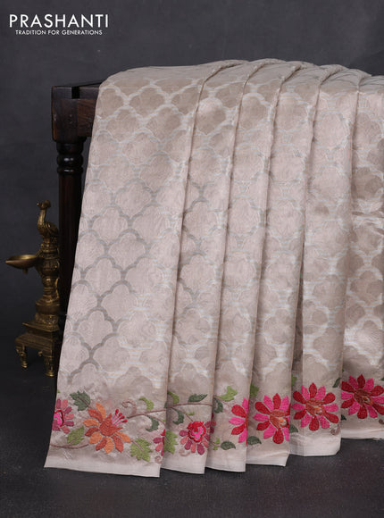 Art tissue silk sare pastel pink with allover brocade weaves and embroidery work border