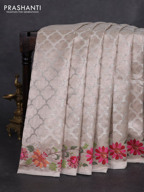 Art tissue silk sare pastel pink with allover brocade weaves and embroidery work border