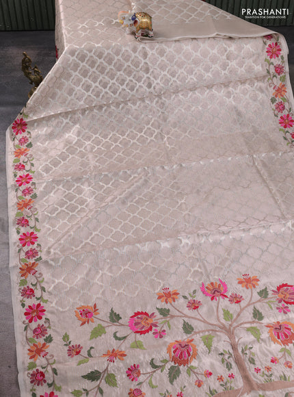Art tissue silk sare pastel pink with allover brocade weaves and embroidery work border