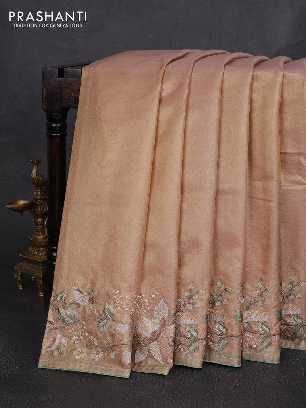 Art tissue silk sare golden peach and pastel green with plain body and embroidery work border