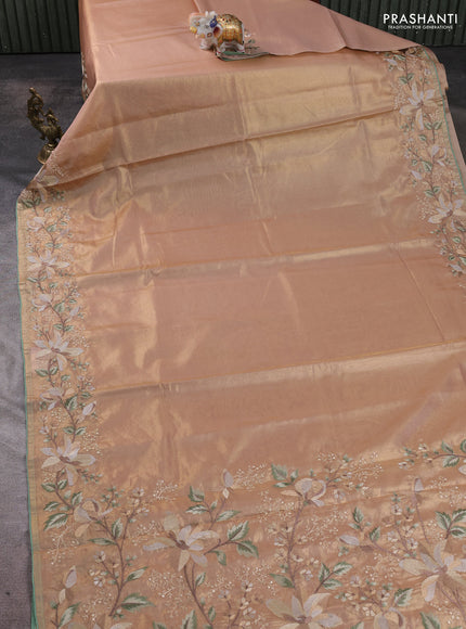 Art tissue silk sare golden peach and pastel green with plain body and embroidery work border