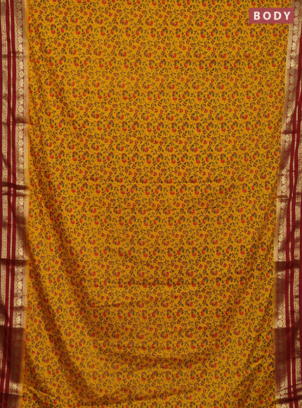 Semi mysore silk saree orange and maroon with allover floral prints and zari woven border