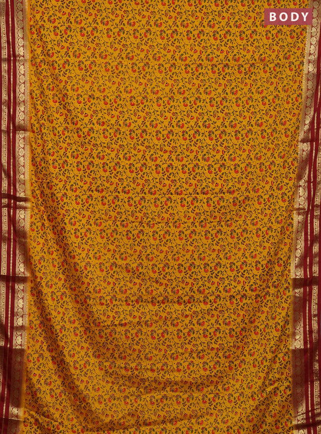 Semi mysore silk saree orange and maroon with allover floral prints and zari woven border