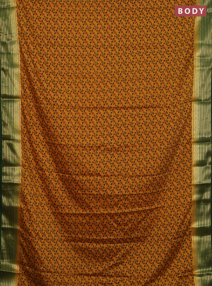 Semi mysore silk saree mustard yellow and green with allover floral prints and zari woven border