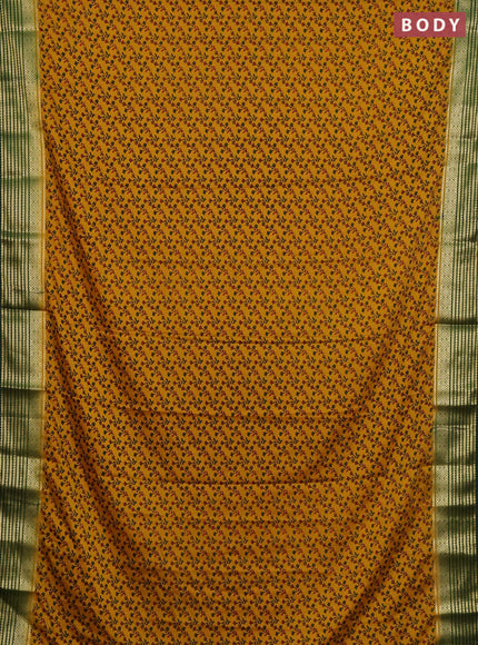 Semi mysore silk saree dark mustard and green with allover floral prints and zari woven border