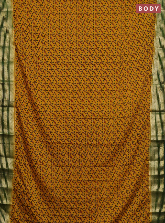 Semi mysore silk saree dark mustard and green with allover floral prints and zari woven border