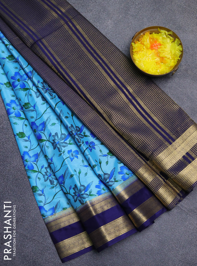 Semi mysore silk saree light blue and navy blue with allover floral prints and rettapet zari woven border