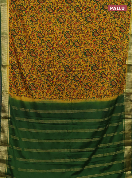 Semi mysore silk saree dark mustard and green with allover floral prints and zari woven border